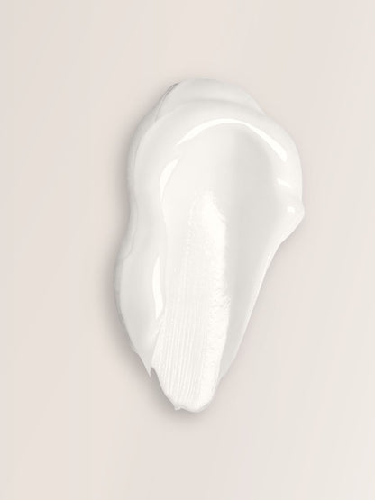 textura de mascarilla capilar hidratante sobre superficie clara